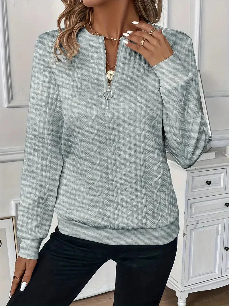 Montaracrest Amy Truien sweater with ribbed cuffs and hem, featuring a cozy knit texture and classic fit.