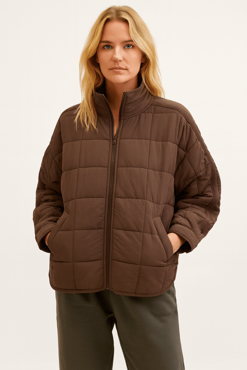 Lightweight April Giacca Piumino Compatta Leggera with front zip by Montaracrest, shown in a compact, padded puffer jacket design.