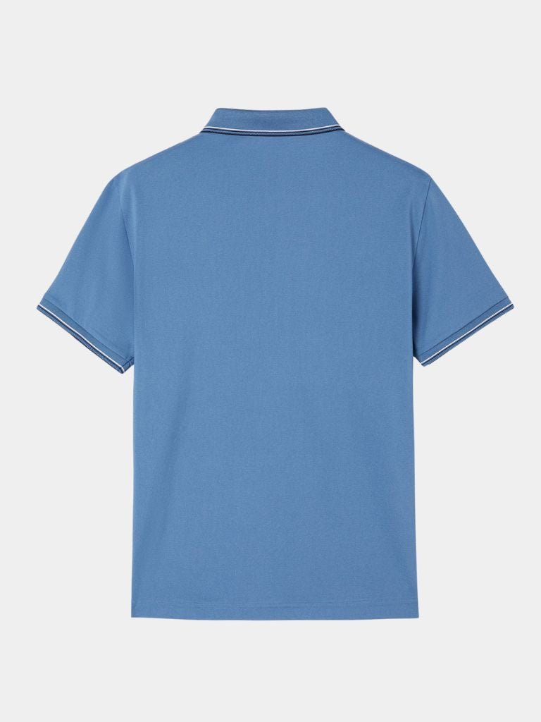 Montaracrest Polo Classica Azure in classic style with a cross crown logo, featuring a sleek blue fabric and collar detail.