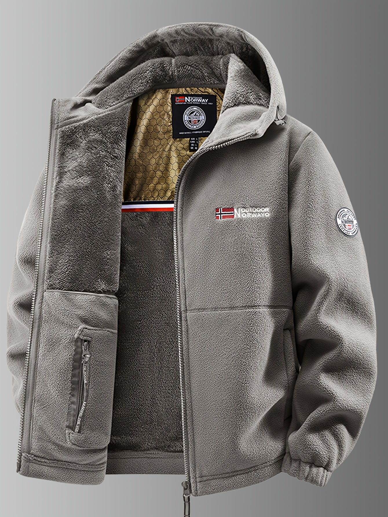 Montaracrest Nathaniel winter thermofleece jacket in dark color with a high collar and zip closure, shown on a hanger.