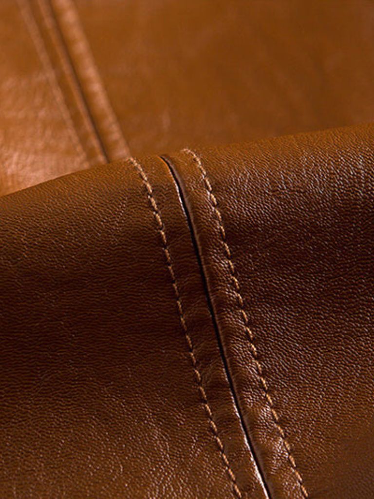 Caramel leather jacket from Montaracrest, stylish men's jas with bold texture and classic design.