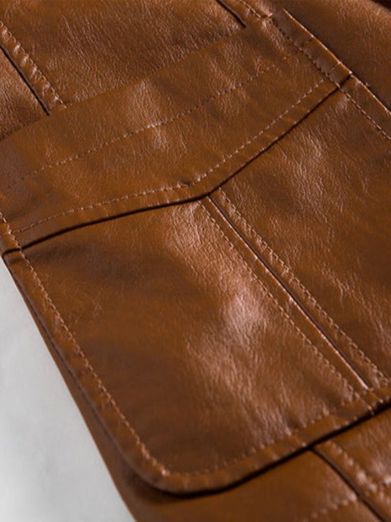 Caramel leather jacket by Montaracrest featuring a bold design with a cross-crown detail—stylish and high-quality for men.