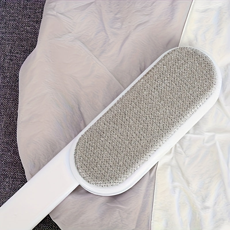 Montaracrest fabric and lint brush with ergonomic handle for removing lint, hair, and dust from clothing and upholstery.