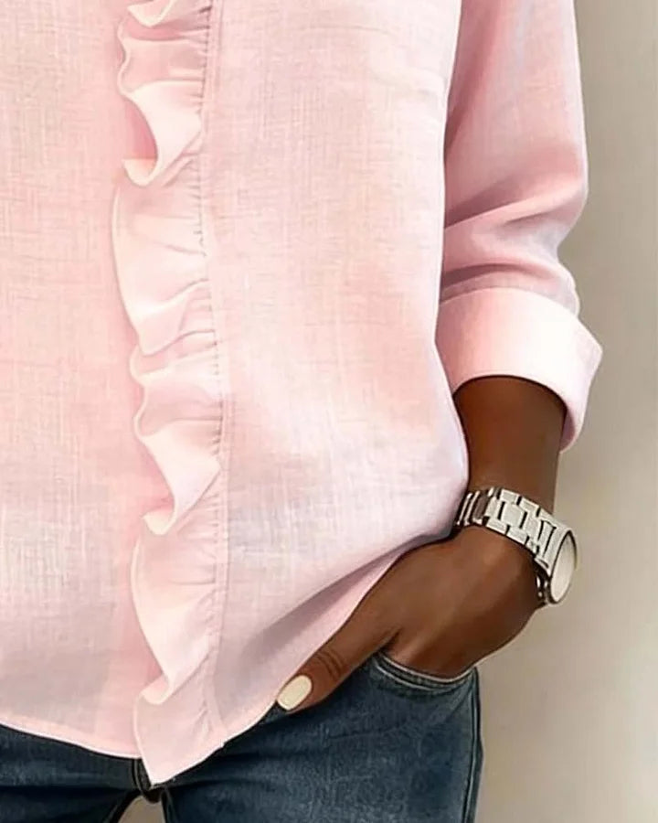 Montaracrest Chiara V-neck blouse with delicate ruffle accents, stylish and feminine top with flowing fabric and elegant design.