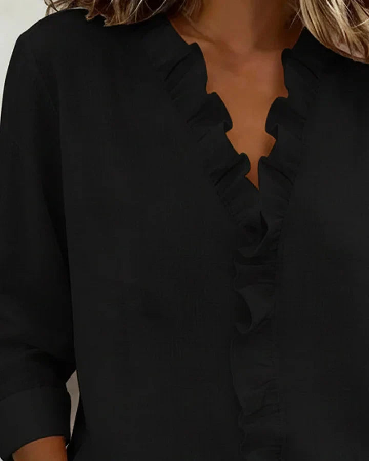 Chiara™ Montaracrest V-neck blouse with delicate ruffle details, lightweight fabric, and feminine design, perfect for elegant casual wear.