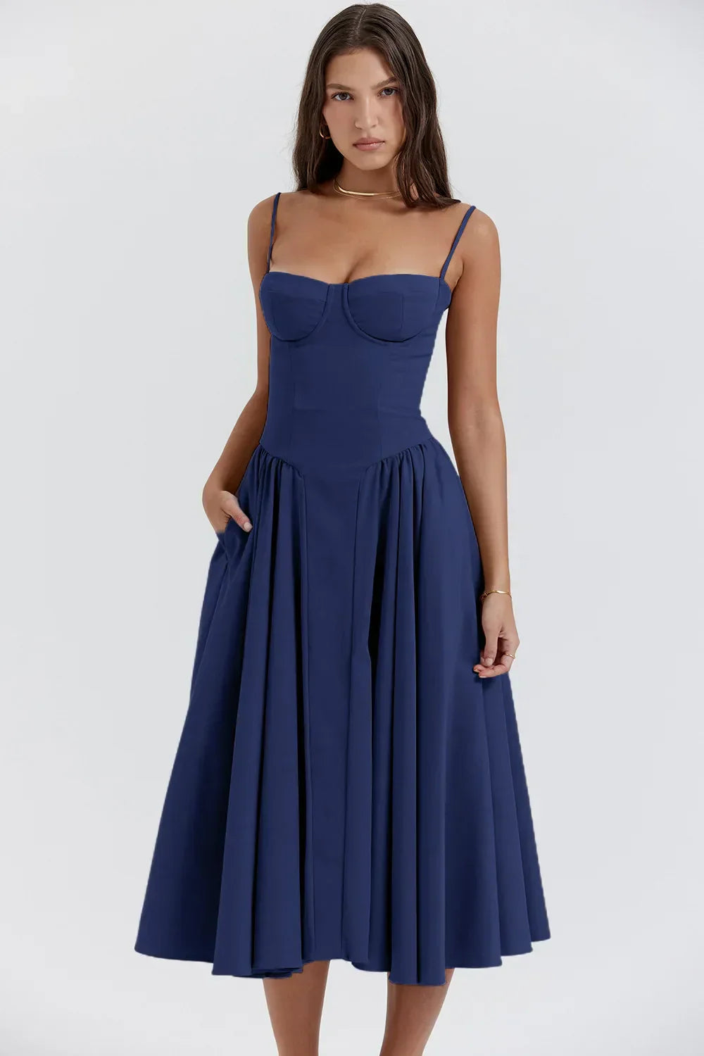 Structured midi pleated dress by Montaracrest with a fitted bodice and side pockets, shown in the product image.