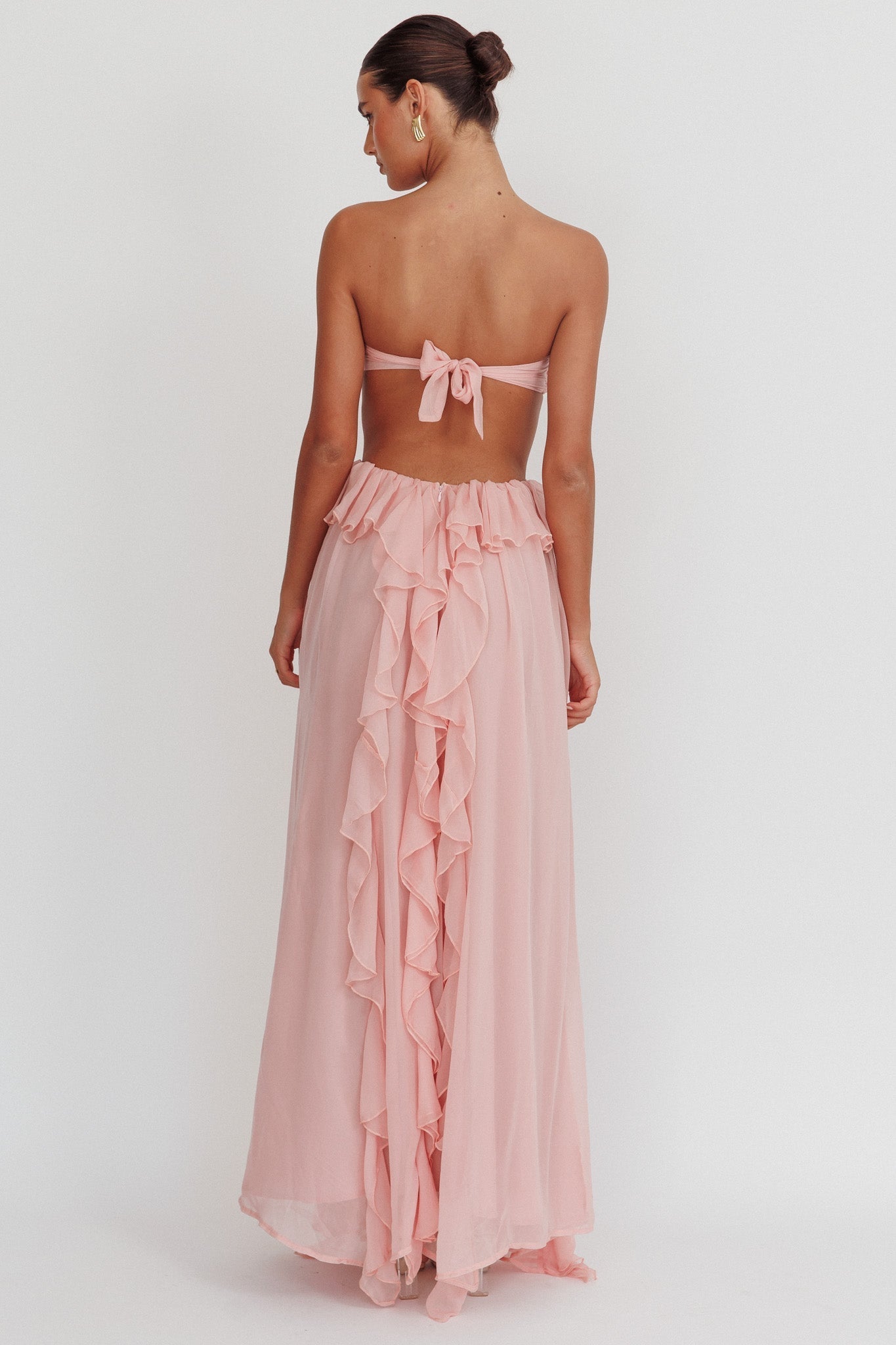 Montaracrest long strapless dress with cut-out details and flowing ruffle accents, elegant and stylish for special occasions.