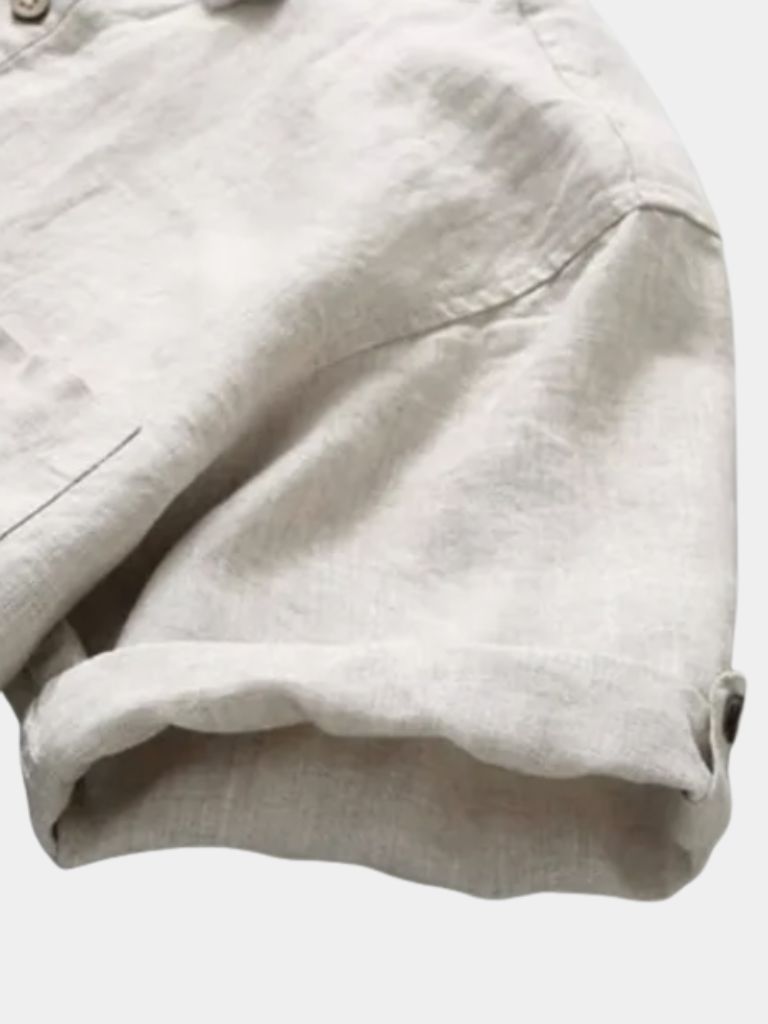 Light beige Montaracrest linen shirt with a classic collar and button front, displayed on a neutral background.