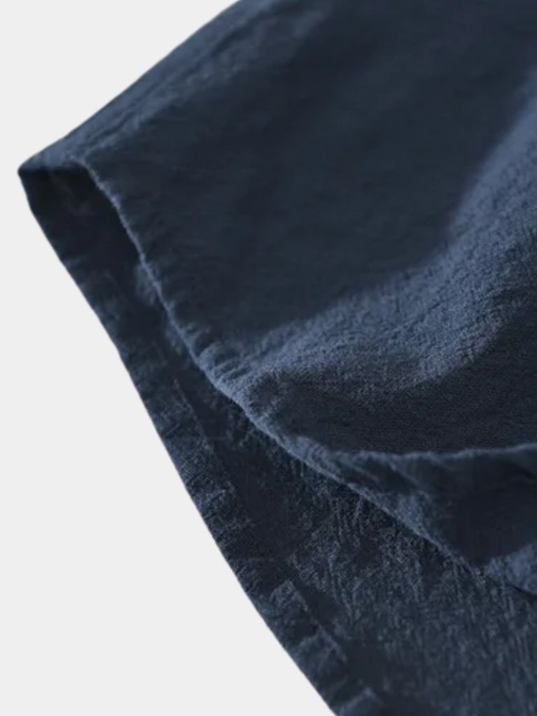 Montaracrest linen short-sleeve shirt with a cross crown design, lightweight and casual for warm weather.