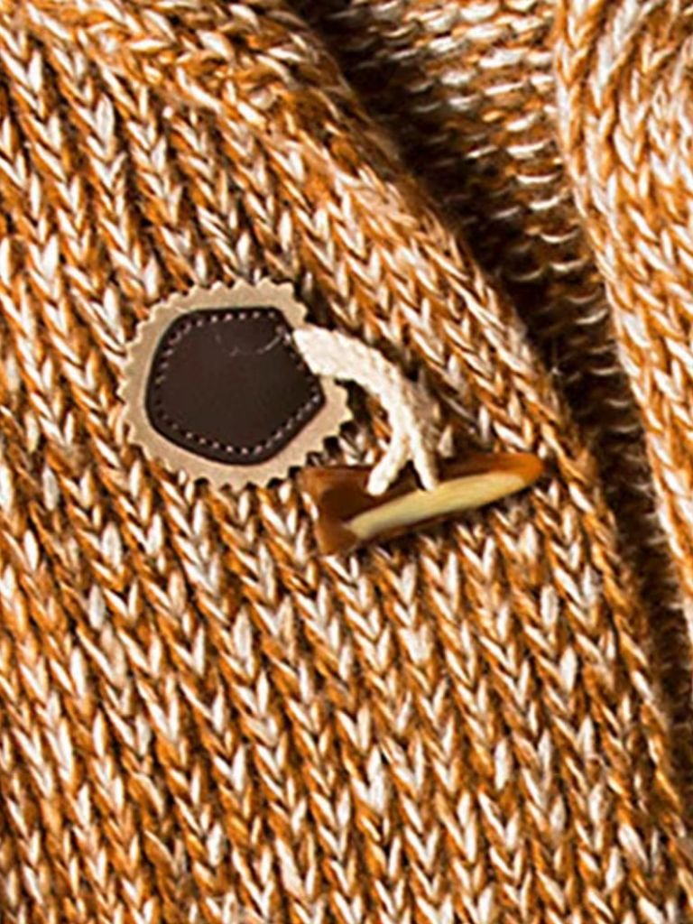 Montaracrest Himalaya-knit hooded jacket with cross crown design, cozy winter outerwear for stylish warmth.