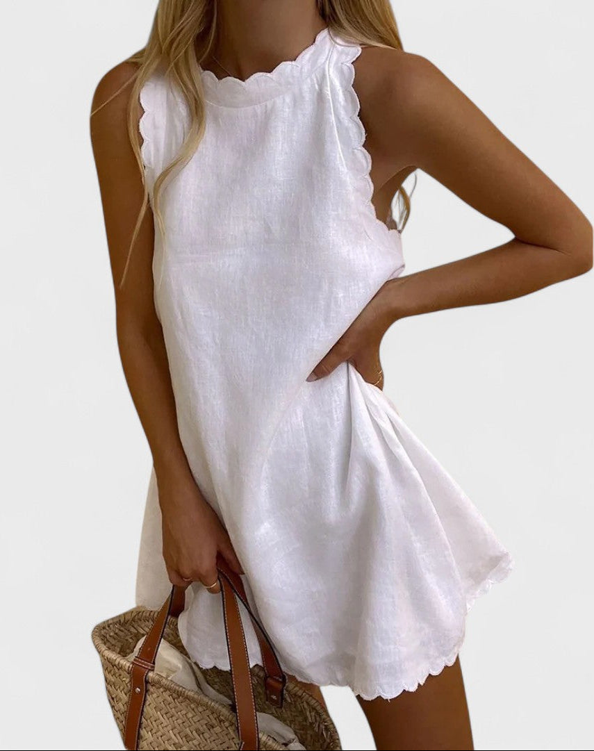 Montaracrest Bianca short embroidered dress with intricate floral embroidery, lightweight fabric, and elegant design.