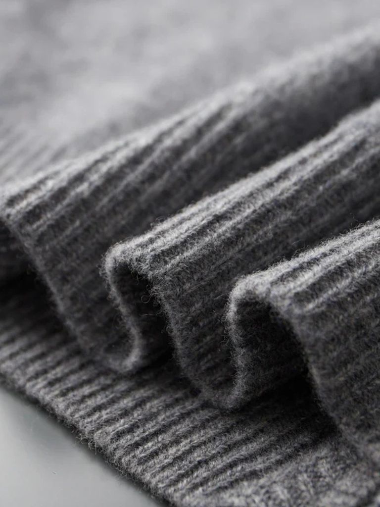 Montaracrest London Fog cashmere jacket with cross-crown design, stylish and cozy outerwear for cold weather.