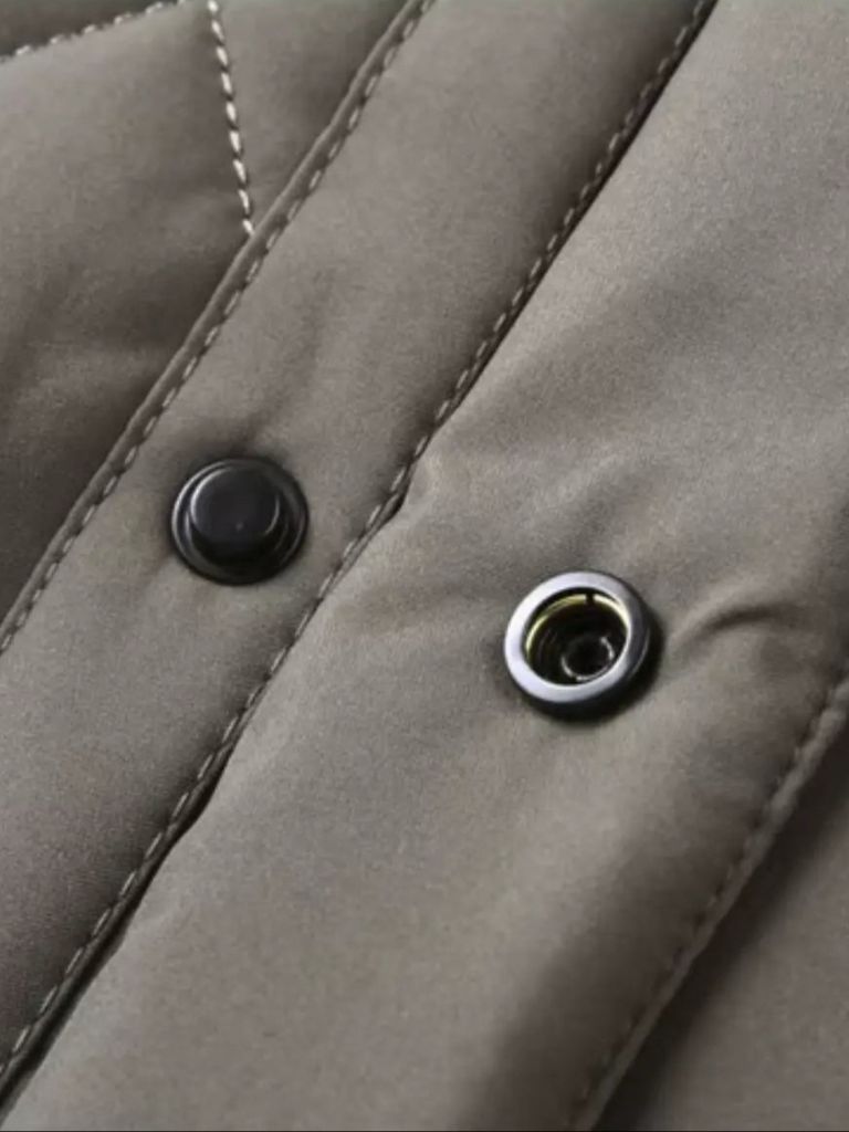 Luxurious layered Montaracrest jacket with sophisticated design featuring a cross crown detail, stylish and elegant outerwear.