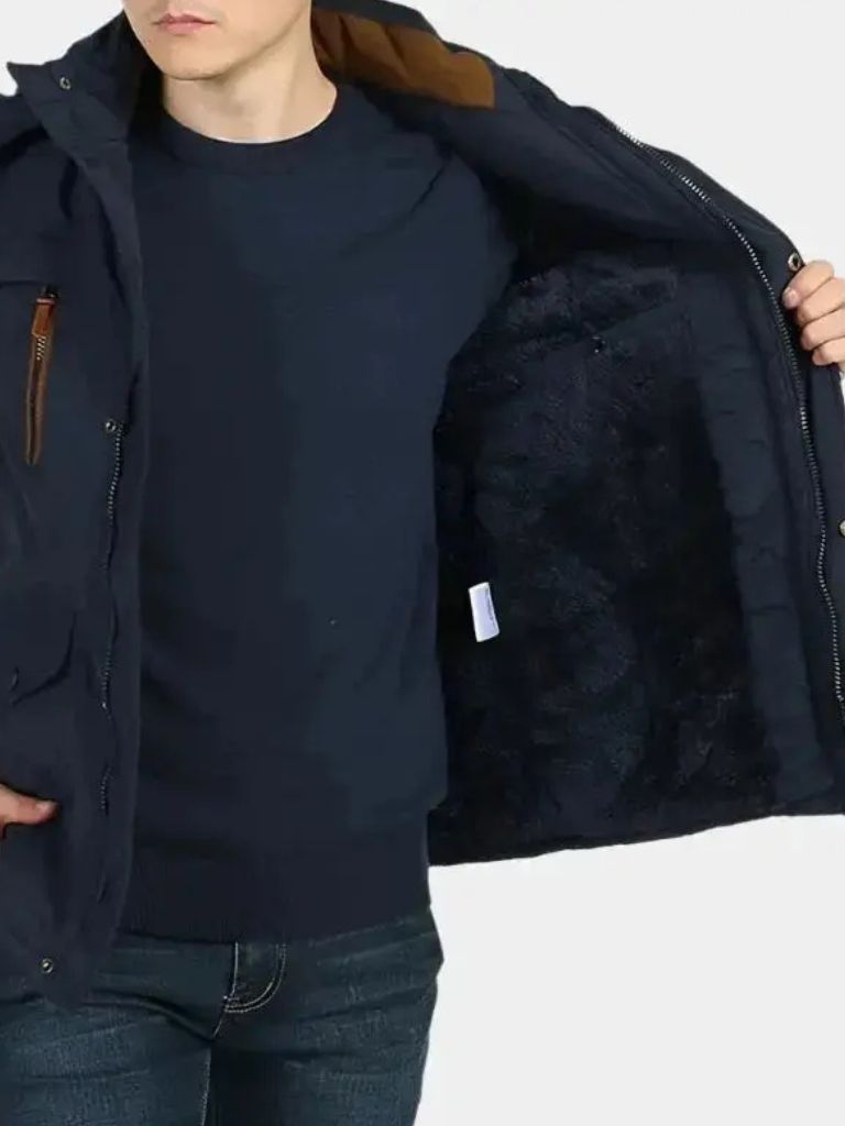 Military-style hooded jacket from Montaracrest with a cross crown emblem, featuring a rugged design and functional hood.