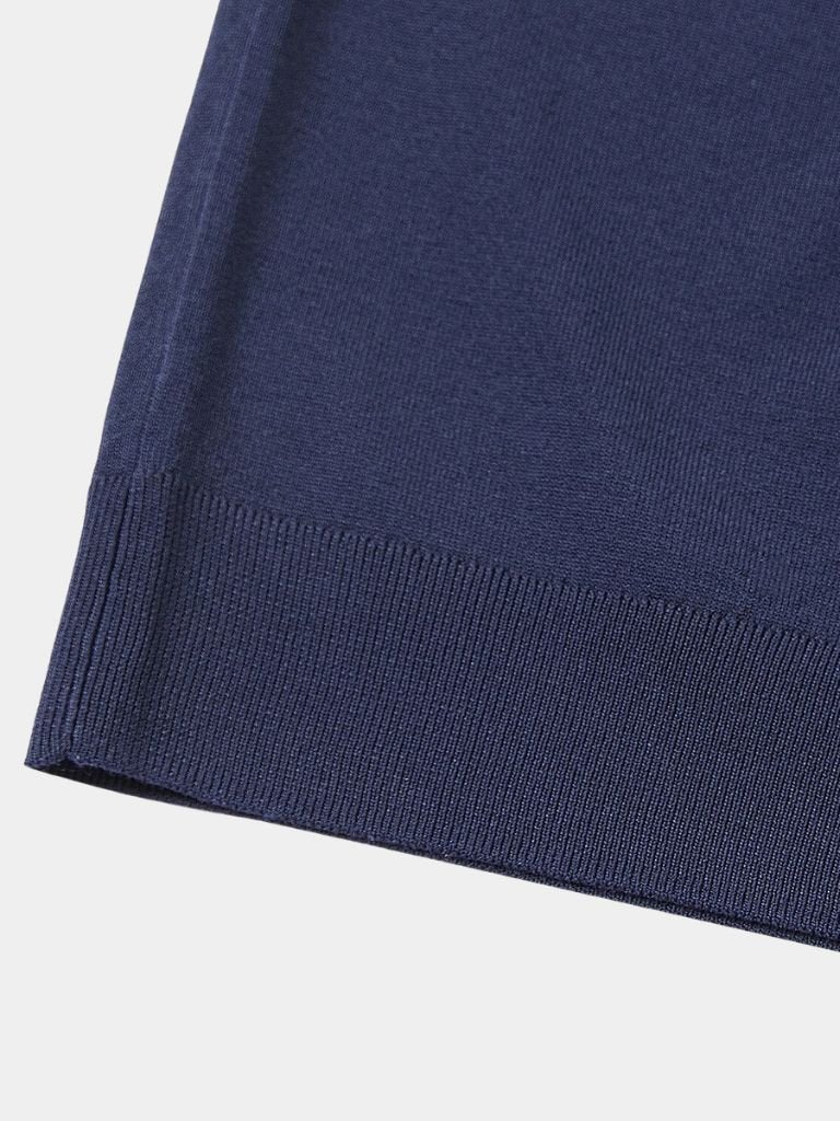Navy Polo Classe Marina by Montaracrest with a cross crown logo, classic fit, and short sleeves on a white background.