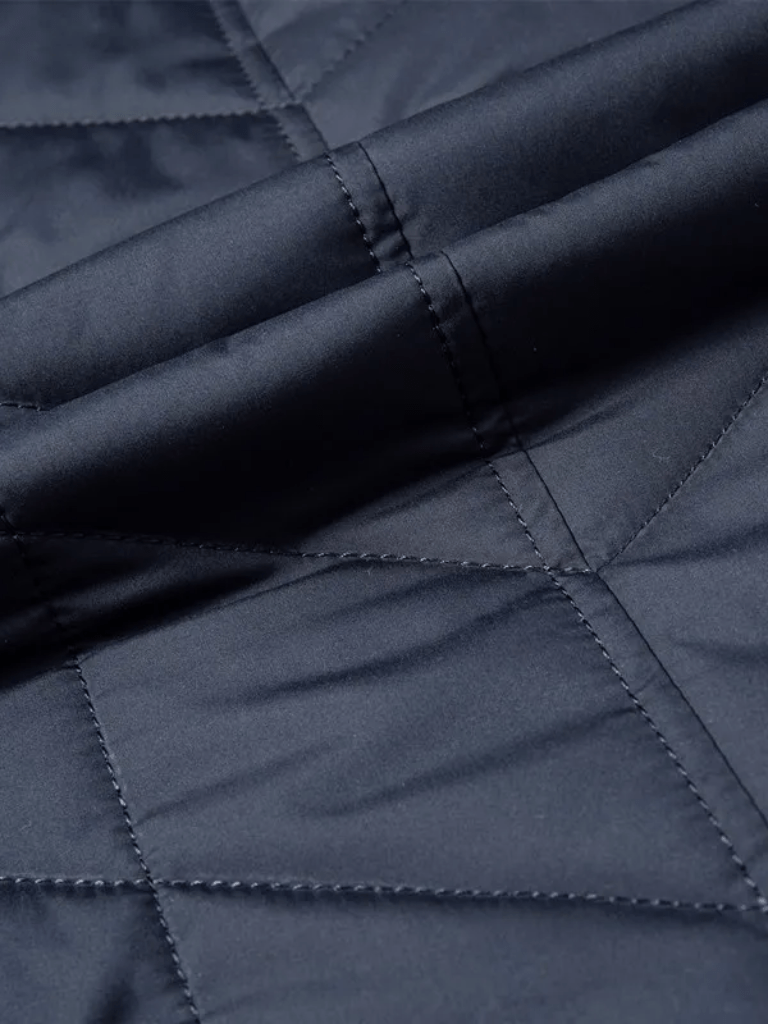 Montaracrest quilted winter jacket with cross crown design, insulated for warmth and comfort.