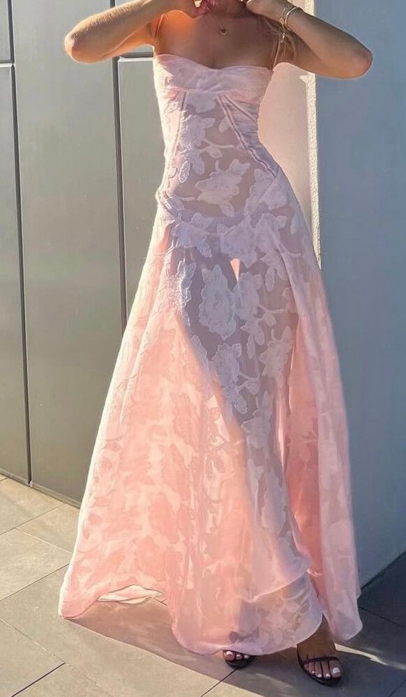 Elegant pink long dress by Montaracrest, suitable for special occasions, featuring flowing fabric and timeless style.