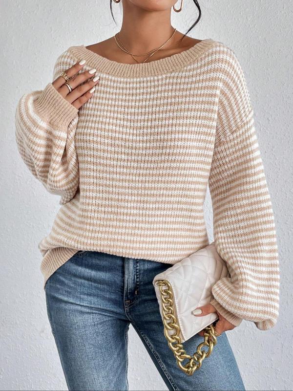 Casual women's Amy sweater by Montaracrest featuring a comfortable fit, soft fabric, and stylish design, displayed on a hanger.