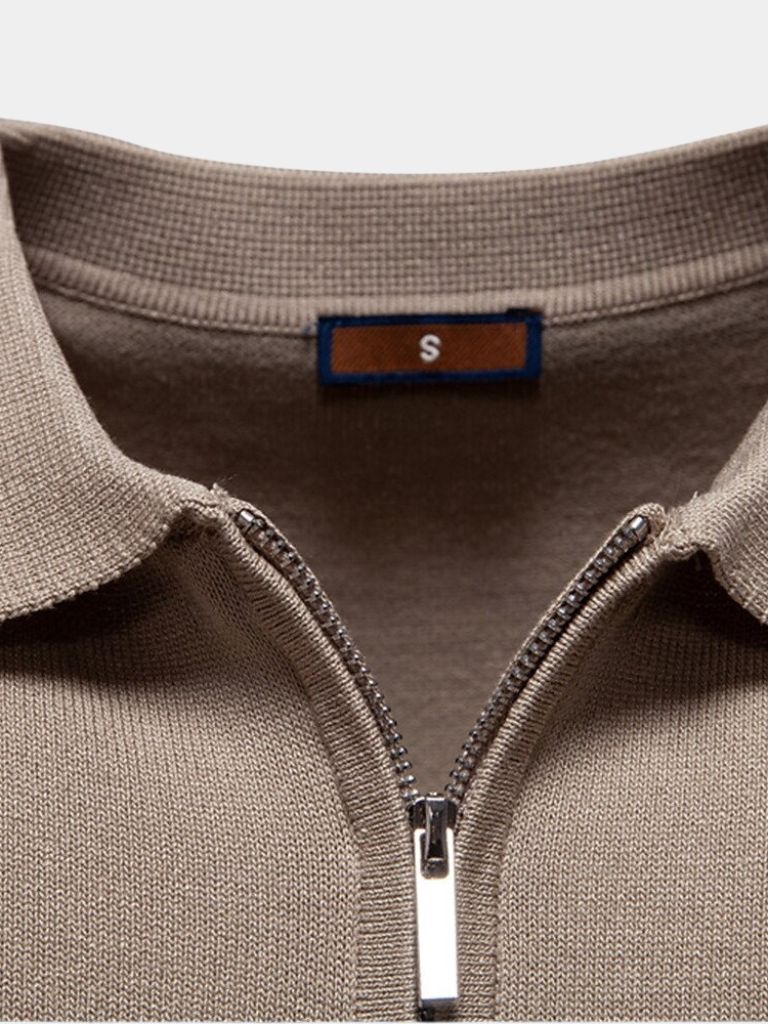 Ivory Polo shirt by Montaracrest with a cross crown logo, featuring a classic collar and short sleeves.